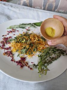 herbs on a plate resting in bed
